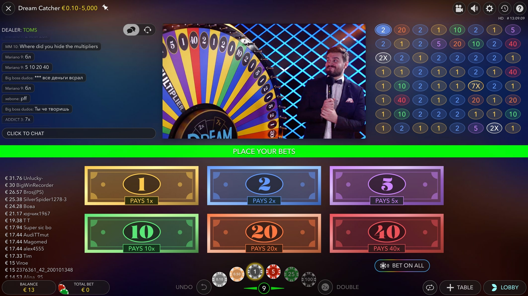 La interfaz del juego Dream Catcher con opciones de apuesta para los números 1, 2, 5, 10, 20 y 40, junto con una sección de chat y apuestas recientes mostradas.